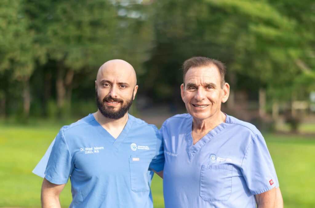 South Jersey periodontist, Dr. Meltzer and Dr. Isleem smiling for a picture.